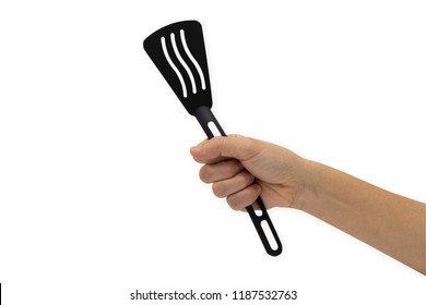 Hand Holding A Spatula Isolated On A White Background.