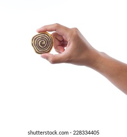 Hand Holding Spiral Cookie On White Background