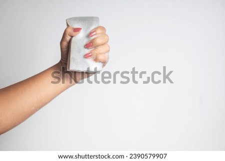 hand holding a sponge with a bubble