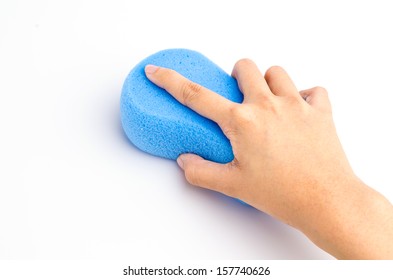 Hand holding sponge on isolated white background