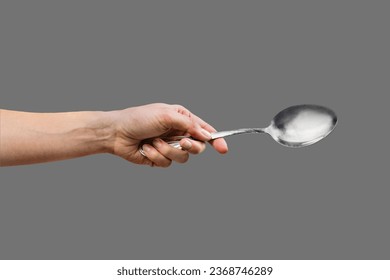 Hand Holding a Spoon Isolated on grey Transparent background - Shutterstock ID 2368746289
