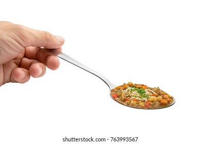 Hand holding spoon soup - Shutterstock ID 763993567