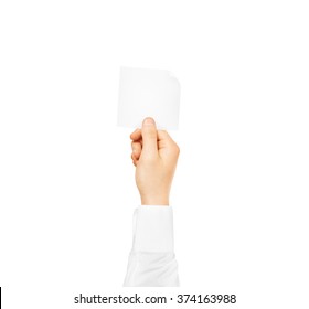Hand holding square blank white sticker mock up isolated. Sticker mockup holder. Empty paper clue remnder hold in hands.
