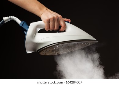 Hand Holding Steam Generator Iron