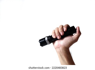 A Hand Holding Steel Flashlight Isolated on White Background. A Person Holding Metal Flash Light. Copy Space - Shutterstock ID 2220483823