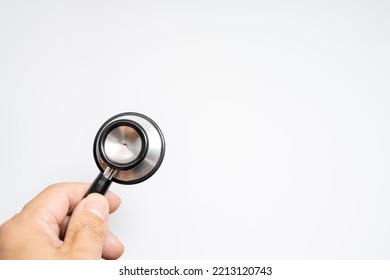 Hand Holding Stethoscope On White Background.