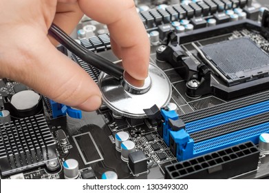 Hand holding stethoscope over motherboard. Diagnostic and repair computer concept.