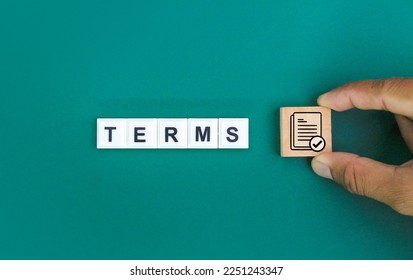hand holding stick with icon and word terms. the concept of terms or conditions. read the terms. - Shutterstock ID 2251243347