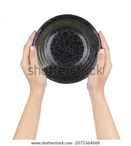 Hand holding Stone ware Bowl Isolated on white background