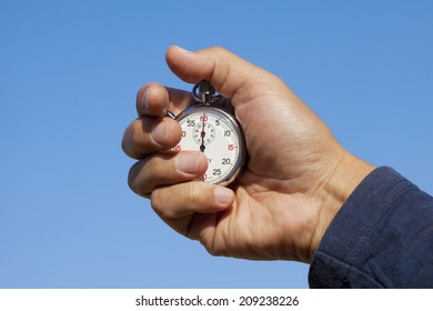 The Hand Holding A Stopwatch