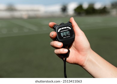 Hand holding stopwatch hand time digital - Powered by Shutterstock