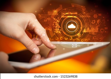 Hand holding tablet with cloud storage technology concept Stock Photo