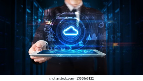 Hand holding tablet with cloud technology and dark concept - Shutterstock ID 1388868122