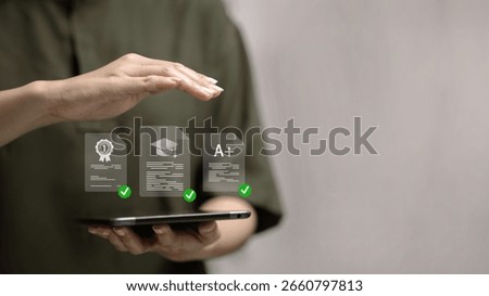 Hand holding tablet with digital certification, A+ grade, and education icons, e-learning, online course, remote study, and academic success concept.
