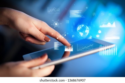Hand holding tablet with global business concept