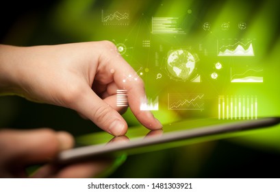 Hand holding tablet with global business concept
