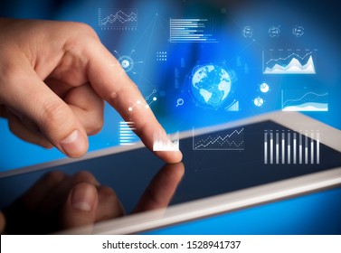 Hand holding tablet with global business concept