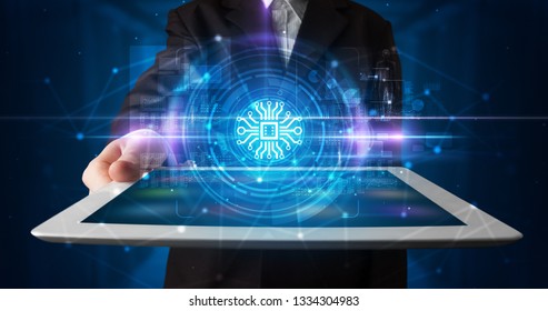 Hand holding tablet with online security and data protection concept - Shutterstock ID 1334304983