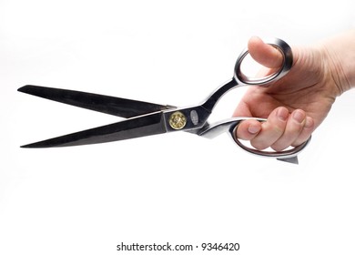 Hand Holding Tailor's Scissors Isolated On White