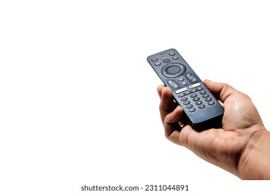 Hand holding television and audio remote control isolated on white background with clipping path - Shutterstock ID 2311044891