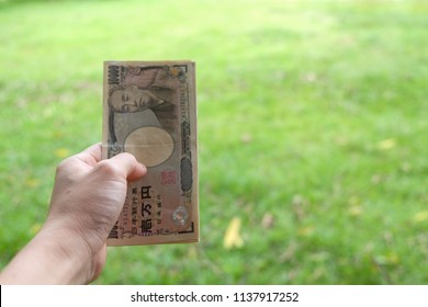 Hand Holding Ten Thousand Yen Banknote Stock Photo 1137917252 ...