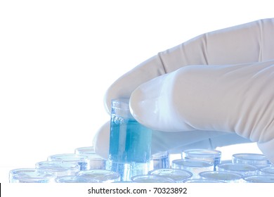 Hand Holding A Test Tube On A White Background.