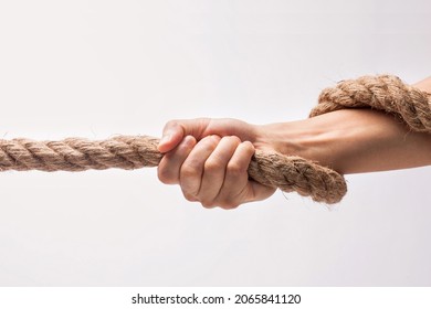 Hand Holding Tight To A Rope.