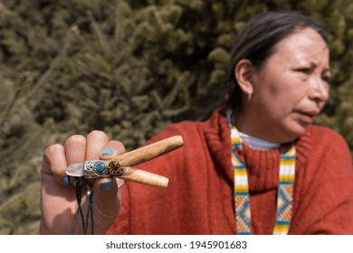 hand holding tobacco pipe snuff ancestral medicine