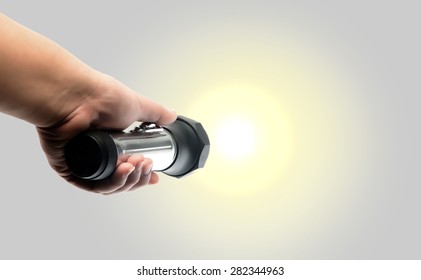 Hand Holding Torch Flashlight