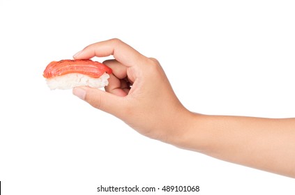 hand holding traditional fresh japanese sushi rolls isolated on white background