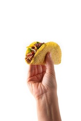 Hand Holding Traditional Mexican Tacos With Meat And Vegetables Isolated On White Background