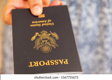 Hand Holding A U.S. Passport 