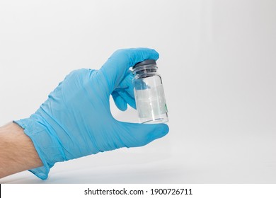 Hand Holding Vial With Vaccine Against Coronavirus.