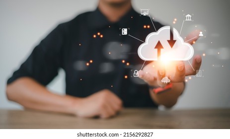 Hand holding virtual cloud computing with world and technology item such as upload download. Cloud technology management big data include business strategy , customer.