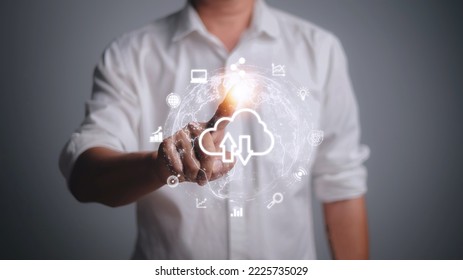Hand holding virtual cloud computing with world and technology item such as upload download. Cloud technology management big data include business strategy , customer.