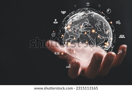 A hand holding a virtual Global Internet connection metaverse, symbolizing fusion of business, technology, and digital marketing. financial and banking sectors, digital link tech and big data.