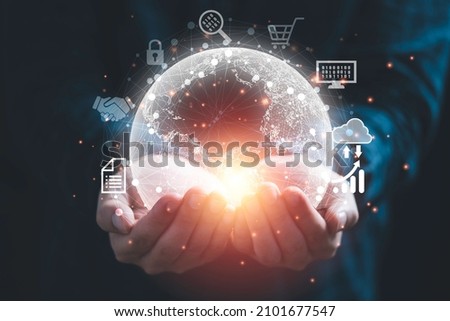 Hand holding virtual world with connection and technology icon for globalisation by metaverse and digital transformation concept.