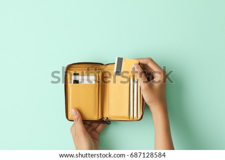 Hand holding wallet take out credit card