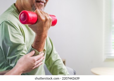 Hand Holding Weight Lifting Close Up, Senior People Doing Physical Therapy After Surgery Operation, Elderly Adult Exercising By Lifting Weights At Home, Medical Treatment Concept