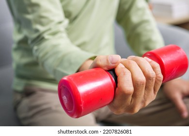 Hand Holding Weight Lifting Close Up, Senior People Doing Physical Therapy After Surgery Operation, Elderly Adult Exercising By Lifting Weights At Home, Medical Treatment Concept