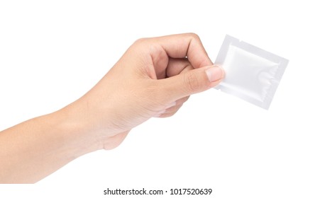 Hand Holding Wet Wipe Tablet Cleaning In Packet Isolated On White Background