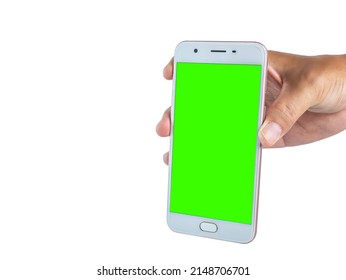 Hand Holding A White Cell Phone The Screen Was Cut Into A Green Scene. Ready To Continue Working And Have Clipping Path On Isolated Background