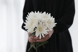 Hand Holding The White Chrysanthemum