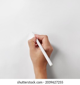 Hand holding a white stylus pen isolated on white background