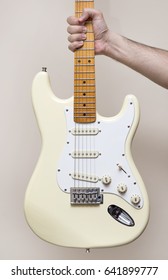 Hand Holding White Vintage Electric Guitar