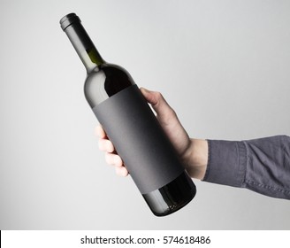 Hand Is Holding Wine Bottle