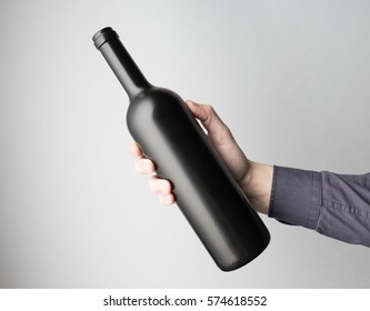 Hand Is Holding Wine Bottle