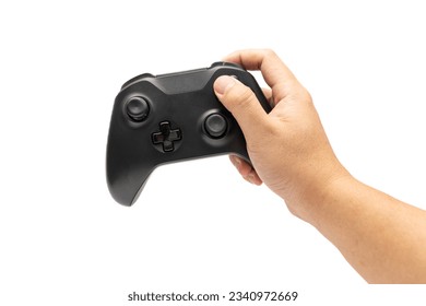 Hand holding Wireless Game Controller isolated on white background. Black game controller. Playful enjoyment concept. 