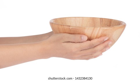 Hand holding Wood bowl isolated on white background