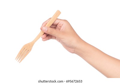 Hand Holding Wood Fork Isolated On White Background.